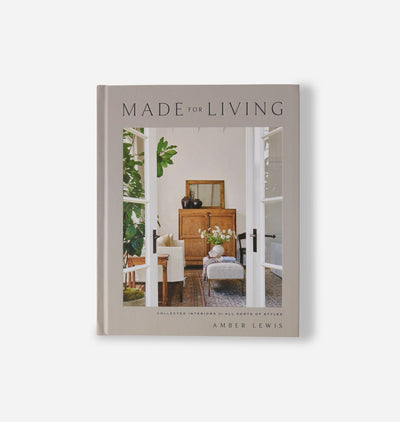 A hardcover book titled 'Made for Living' by Amber Lewis, featuring a warm-toned interior photograph on the cover, set against a clean off-white background.