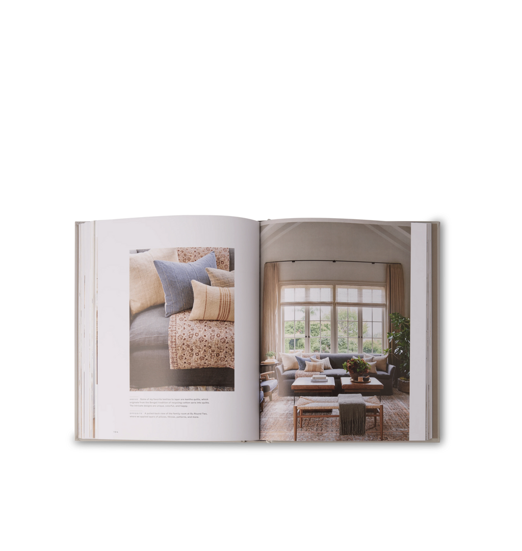 An interior view inside a book featuring home design photos and text set on a white background