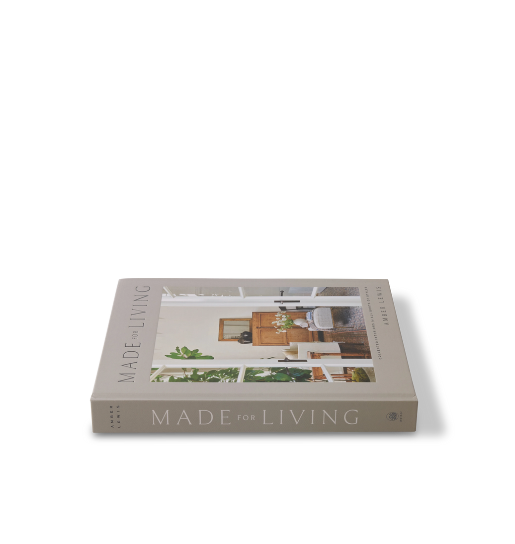 A side view of the spine of the book titled 'Made for Living' shown on a white background