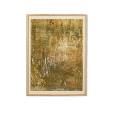 An abstract framed painting featuring textured earthy tones of brown, gold, and olive green with white paint drips, set in a light natural wood frame with a cream mat on a white background.