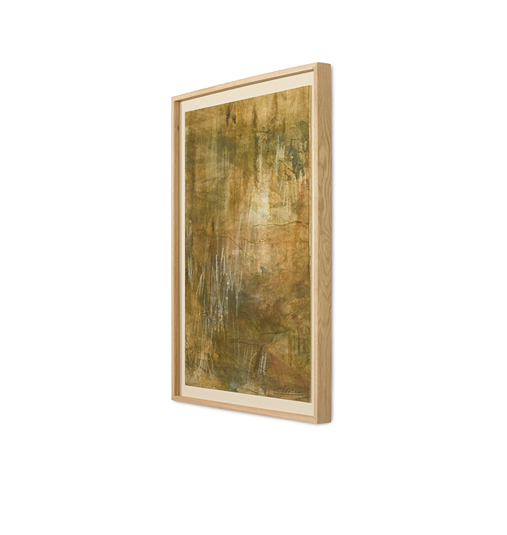 An abstract framed painting featuring textured earthy tones of brown, gold, and olive green with white paint drips, set in a light natural wood frame with a cream mat on a white background.