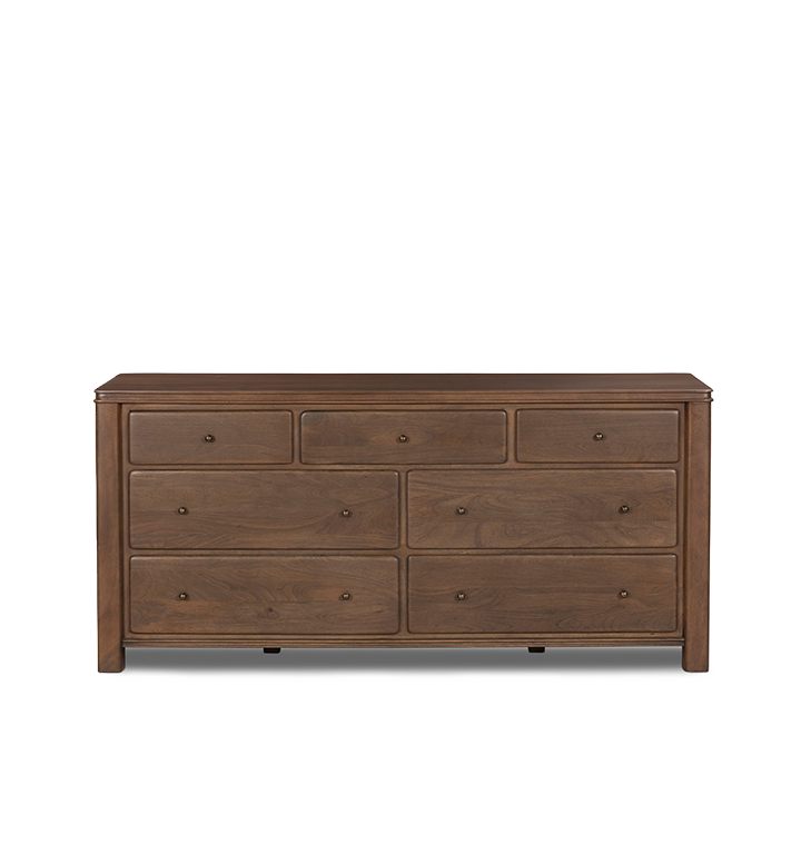 A seven-drawer wooden chest of drawers with small round brass knobs, shown against a plain light gray background.