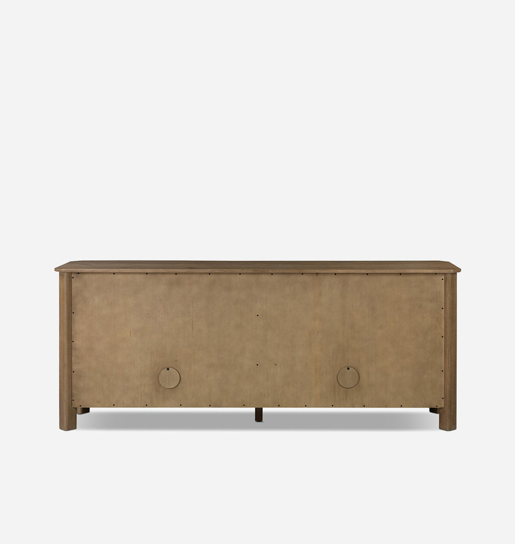 A back view of a rustic wood sideboard cabinet with four doors, small round knobs, and a decorative border along the top, shown against a plain light gray background.