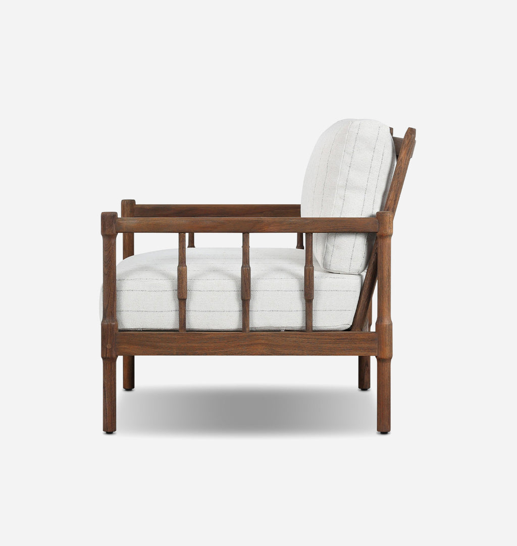 A modern outdoor accent chair with a dark brown wooden frame and white striped cushions, shown against a light gray background.