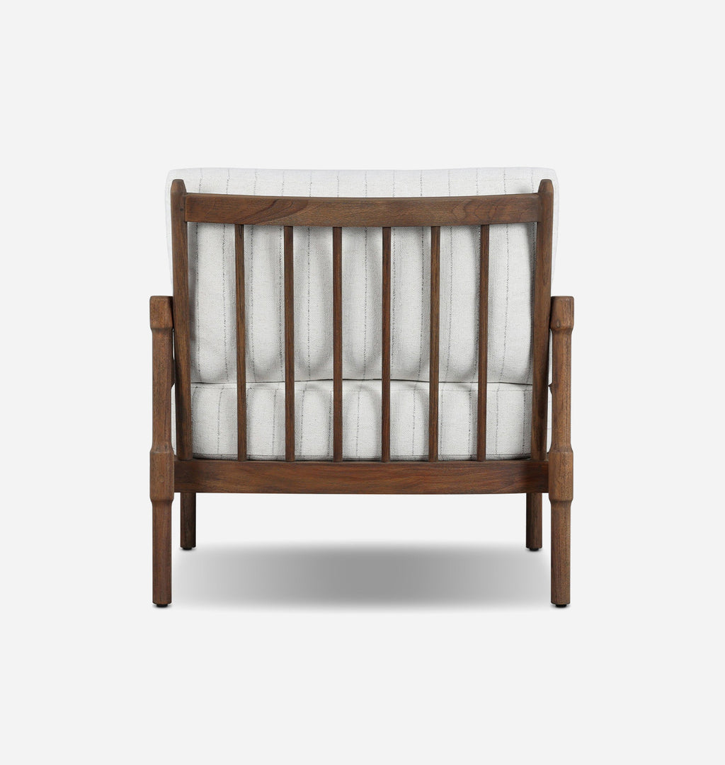 A wooden outdoor armchair with a warm brown frame and white striped upholstery, shown from the back against a light gray background.