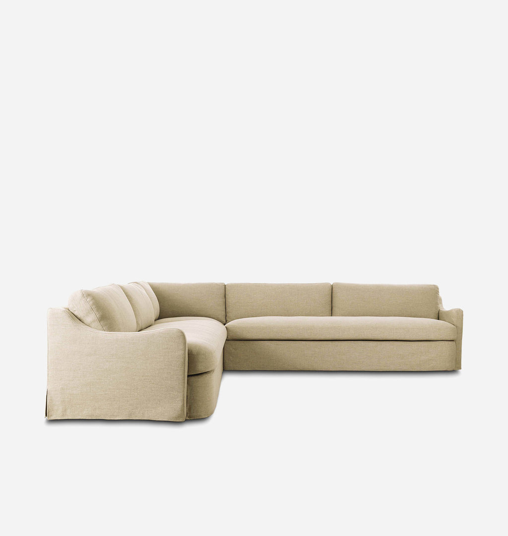 A modern L-shaped sectional sofa upholstered in a light beige textured fabric, shown from a three-quarters angle against a plain white background.