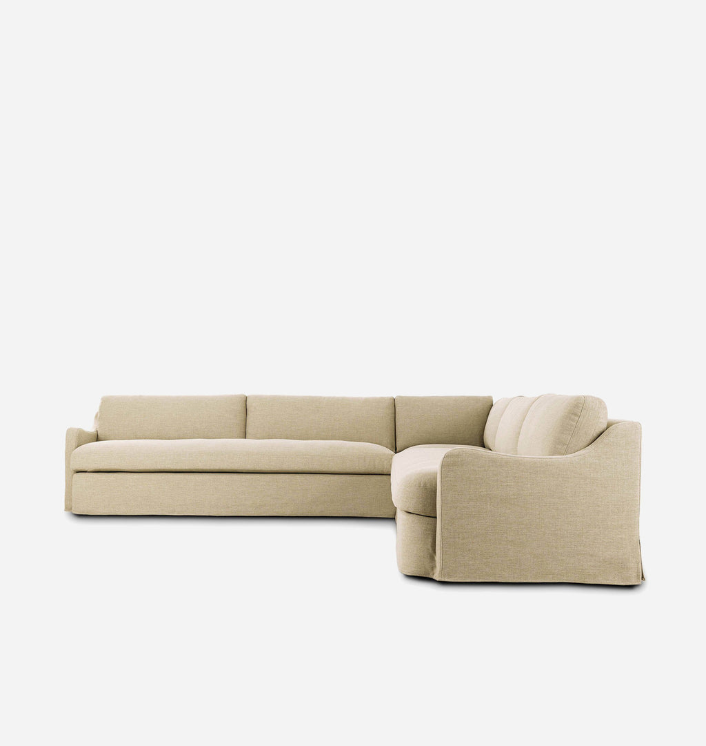A modern L-shaped sectional sofa upholstered in a light beige textured fabric, shown from a three-quarters angle against a solid white background.