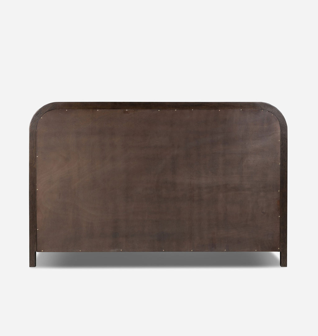 A dark brown wooden bed frame headboard with rounded top corners and small metal nail accents along the outer edge, shown against a plain light gray background.
