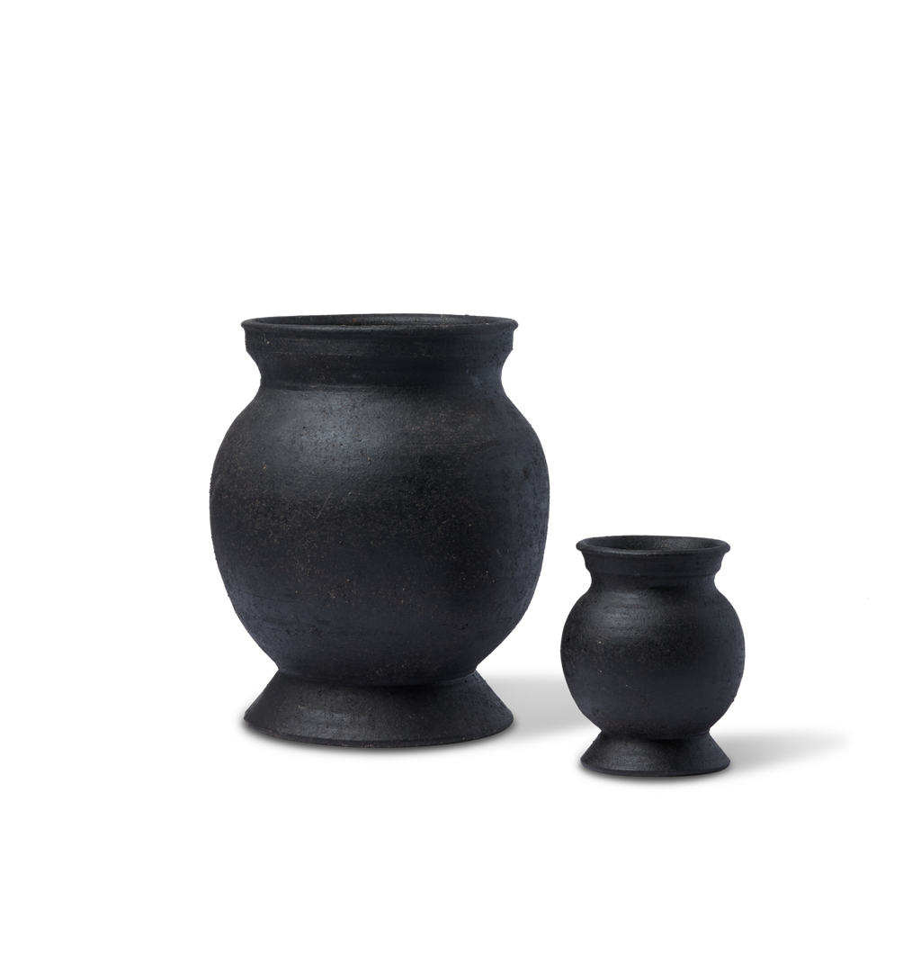 Two round vases set on a white background