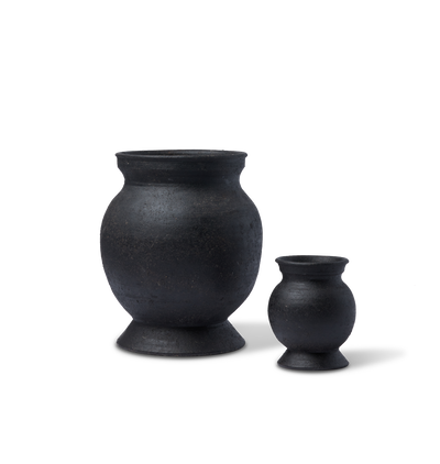 Two round vases set on a white background