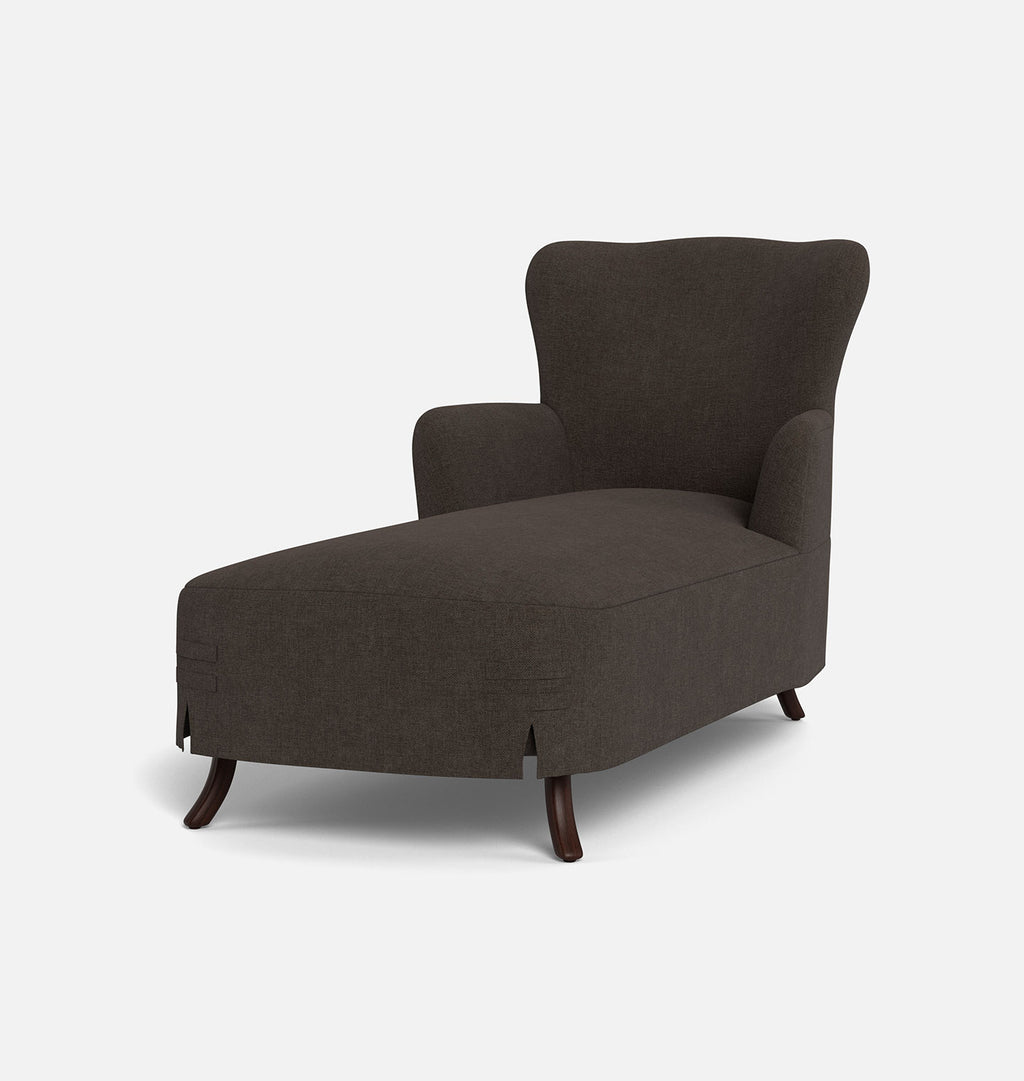 A dark brown upholstered chaise lounge chair with dark wooden legs, shown from a three-quarter angle against a light gray background.