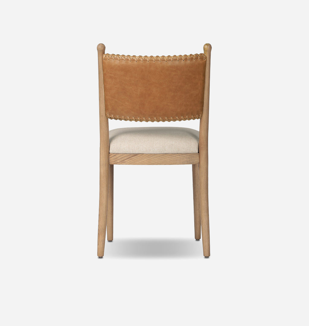 A wooden dining chair with a natural oak frame, a tan leather backrest with a scalloped edge, and a light beige upholstered seat, shown against a plain white background.