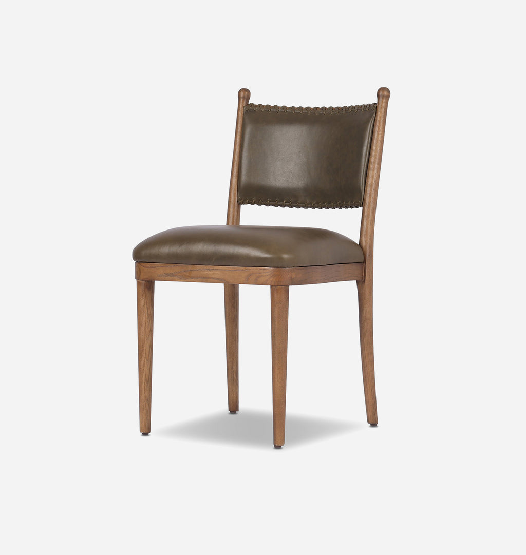 A wooden dining chair with a brown leather upholstered seat and backrest, featuring a nailhead-trimmed backrest and tapered legs, shown against a plain white background.