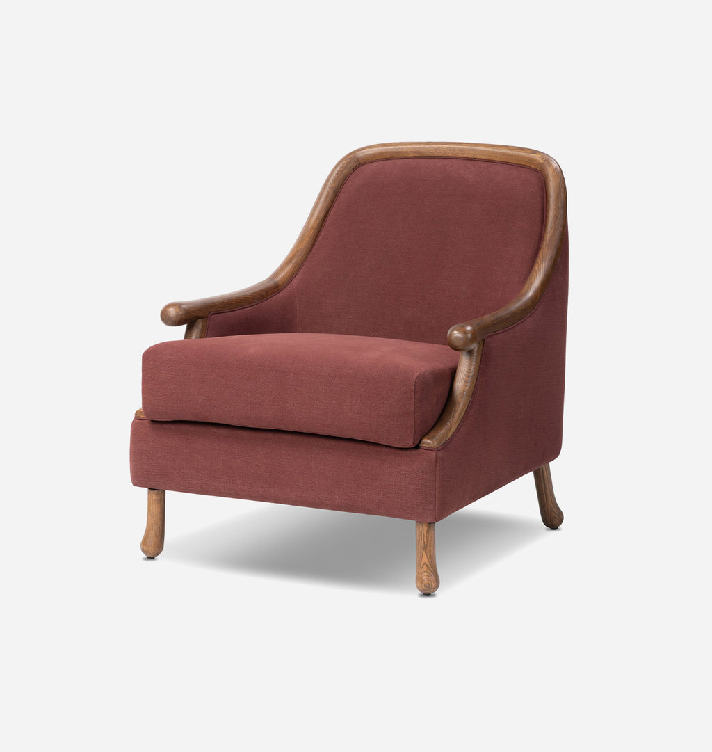 A classic armchair with reddish-brown upholstered fabric and a natural wood frame, shown from a three-quarter angle on a light gray background.