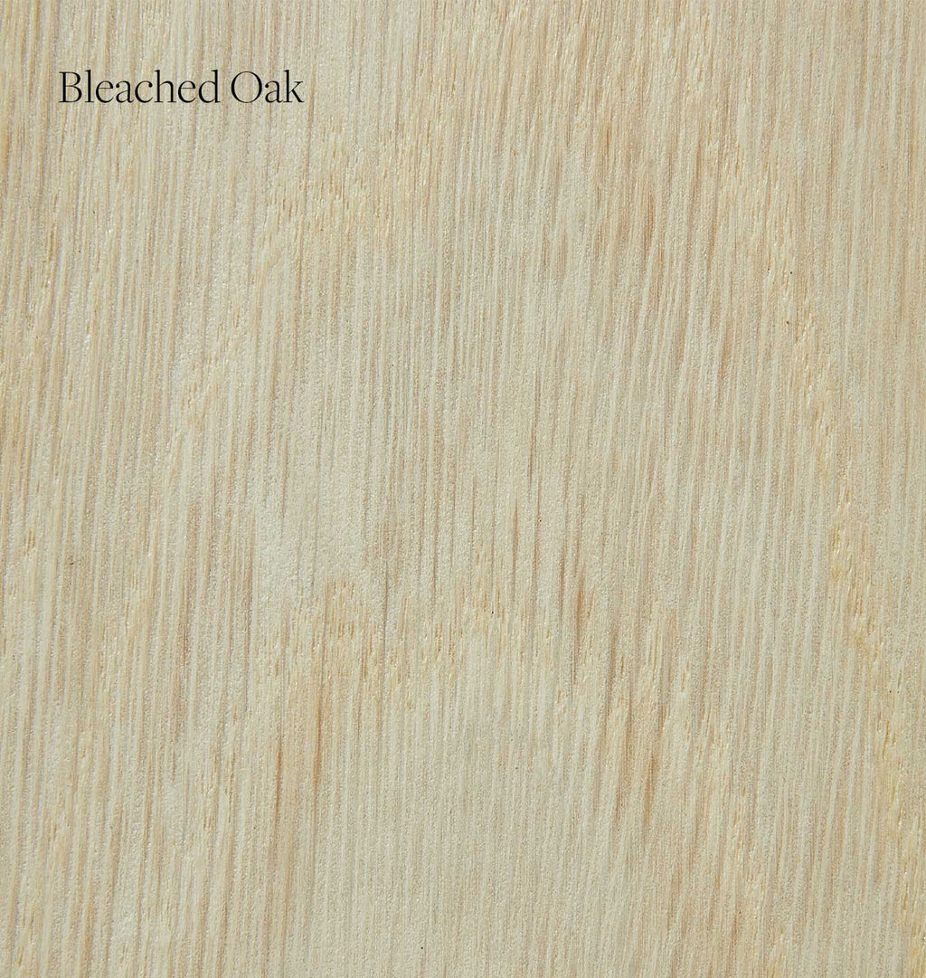 A close-up texture sample of bleached oak wood grain with the text 'Bleached Oak' in the upper left corner.