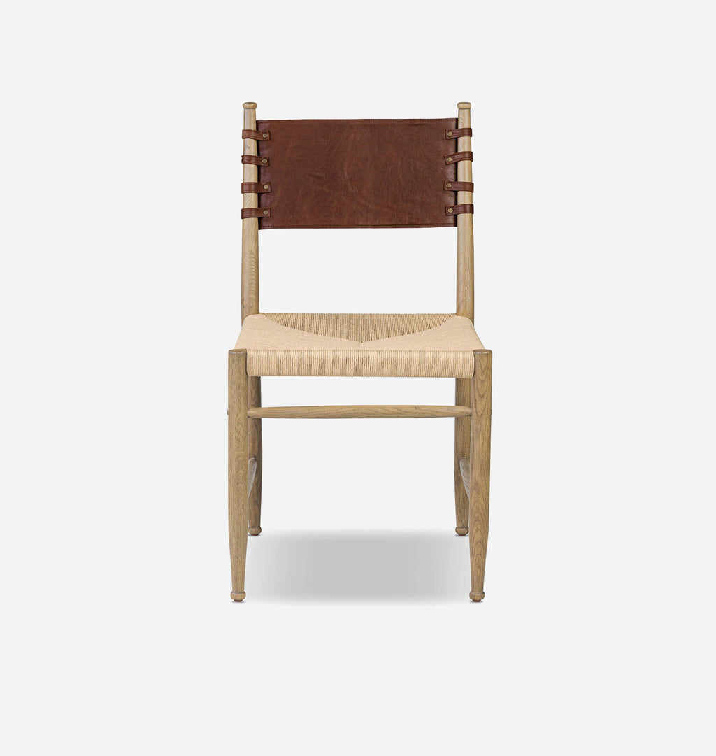 A mid-century modern wooden dining chair with a natural oak frame, a woven beige seat, and a dark brown leather backrest.