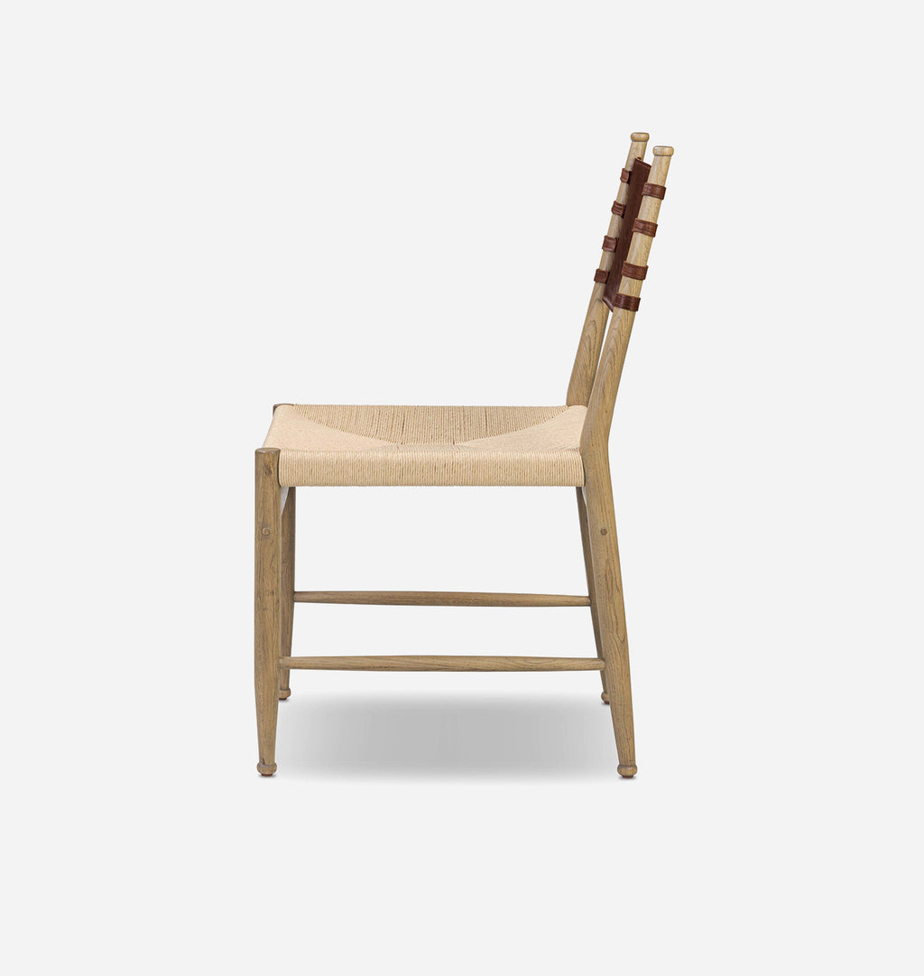 A light oak wood dining chair with a woven natural fiber seat and backrest, accented by dark brown leather straps on the vertical slats, shown from a side profile against a light gray background.