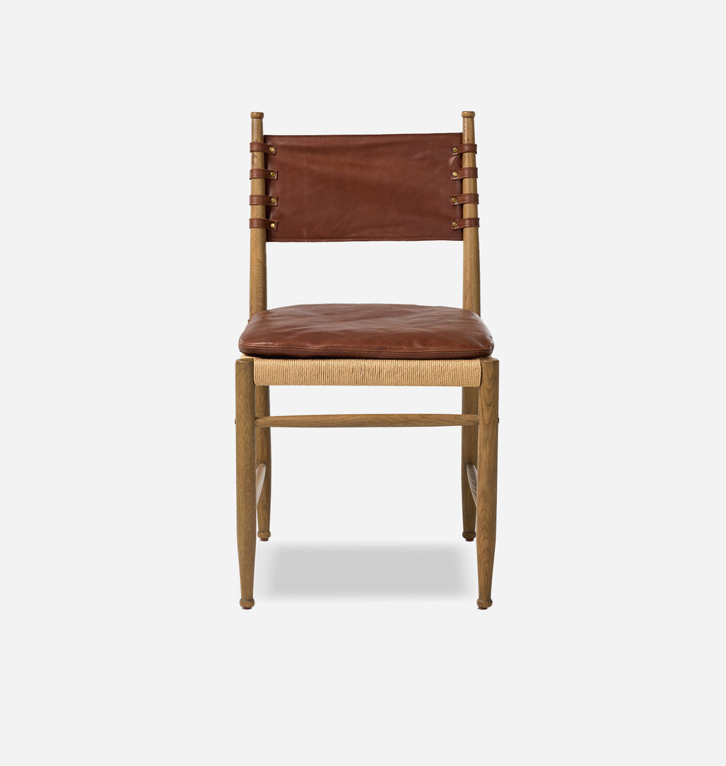 A mid-century modern wooden dining chair with a brown leather seat cushion and a matching leather backrest, supported by a natural wood frame, shown against a light gray background.