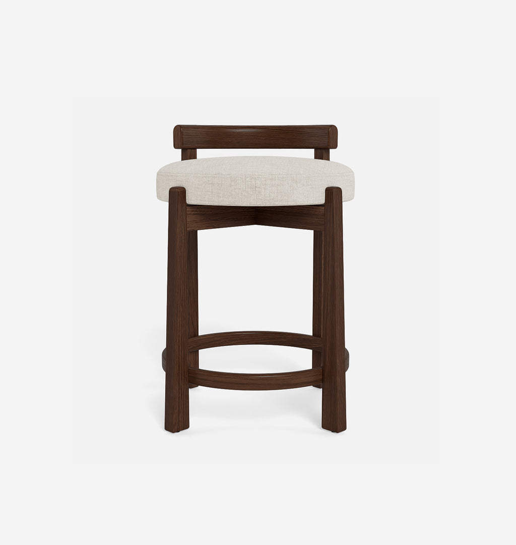 A modern barstool with a dark brown wooden frame and a light beige textured fabric seat cushion, shown against a plain white background.