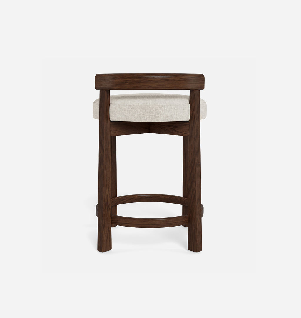 A modern barstool with a dark brown wooden frame and a light beige textured fabric seat cushion, shown from the front on a clean white background.