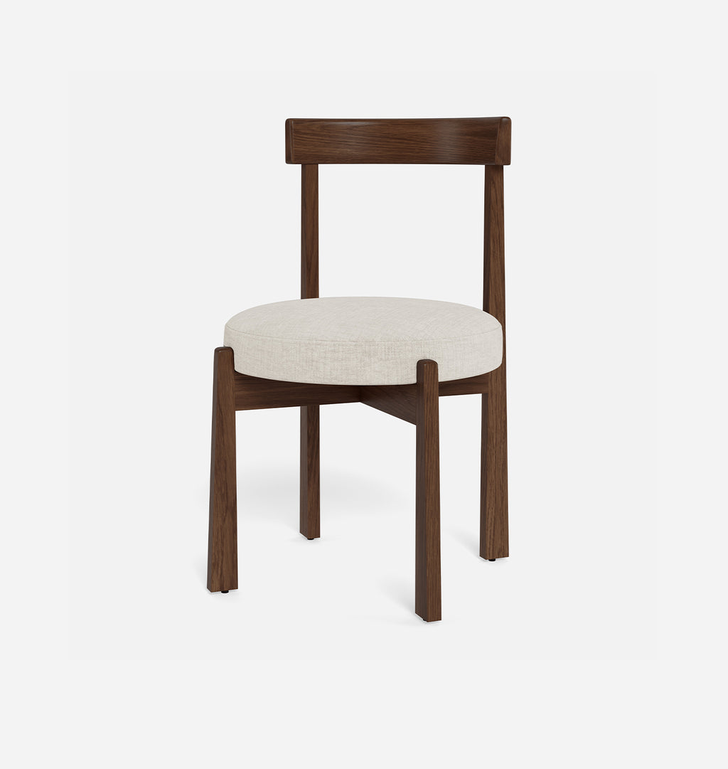 A modern dining chair with a dark brown wooden frame and a round, light beige upholstered seat cushion, shown against a plain white background.