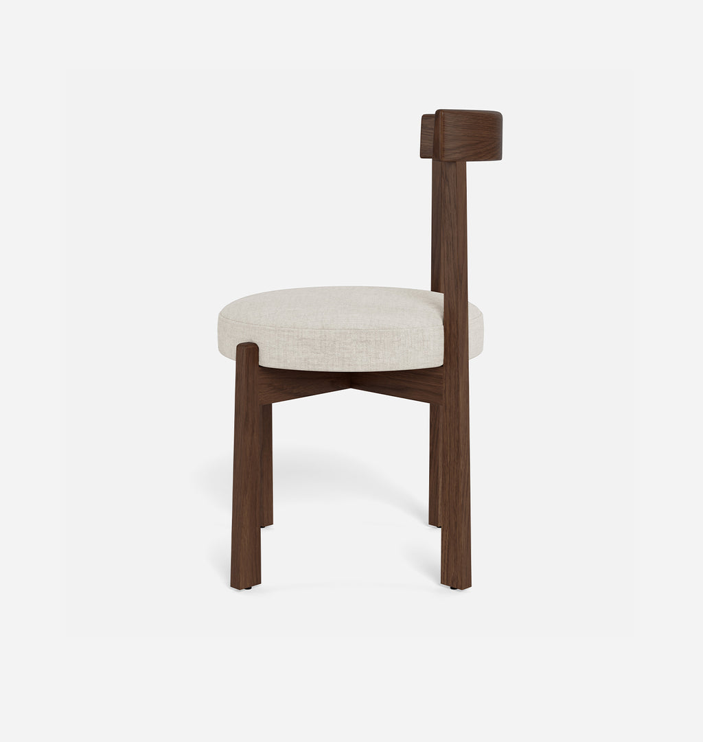 A modern dining chair with a dark brown wooden frame and a round off-white upholstered seat cushion, shown against a plain white background.