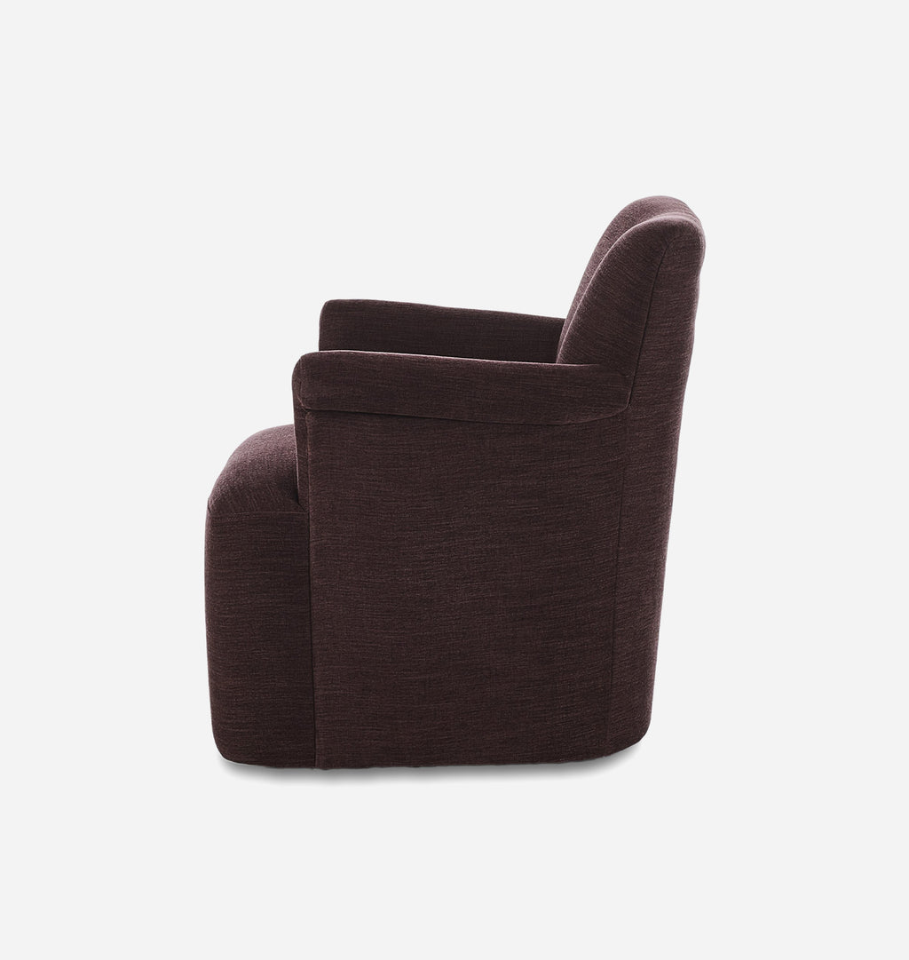 A dark plum upholstered armchair shown from a side angle against a plain white background.