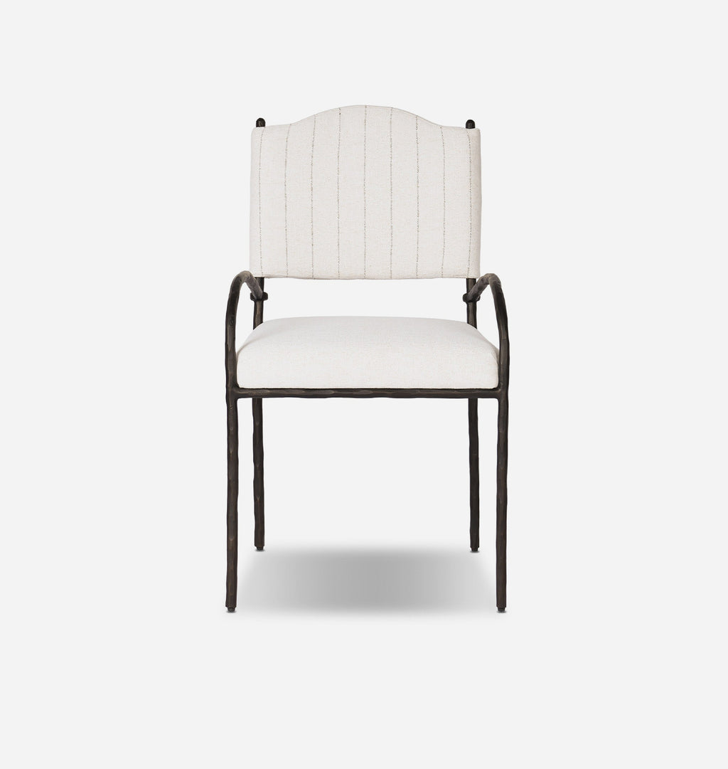 A modern outdoor accent chair with a dark metal frame and off-white striped fabric upholstery on the seat and curved backrest, shown against a light gray background.