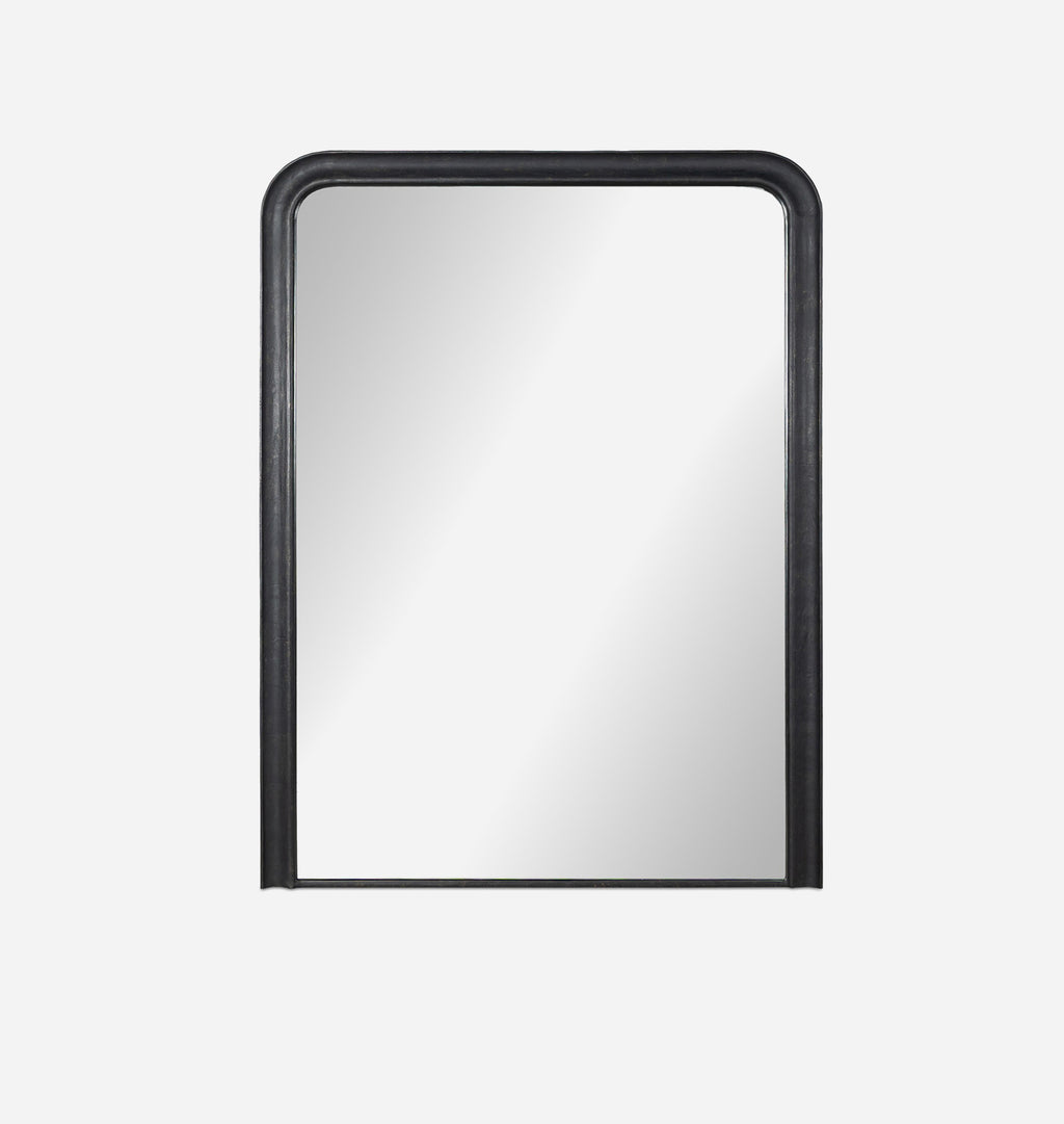 An oversized black aluminium floor mirror with curved corners and a thick frame set against a white background