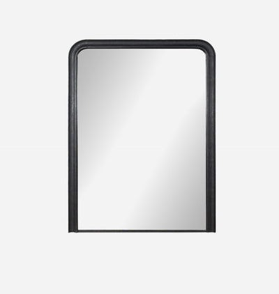 An oversized black aluminium floor mirror with curved corners and a thick frame set against a white background