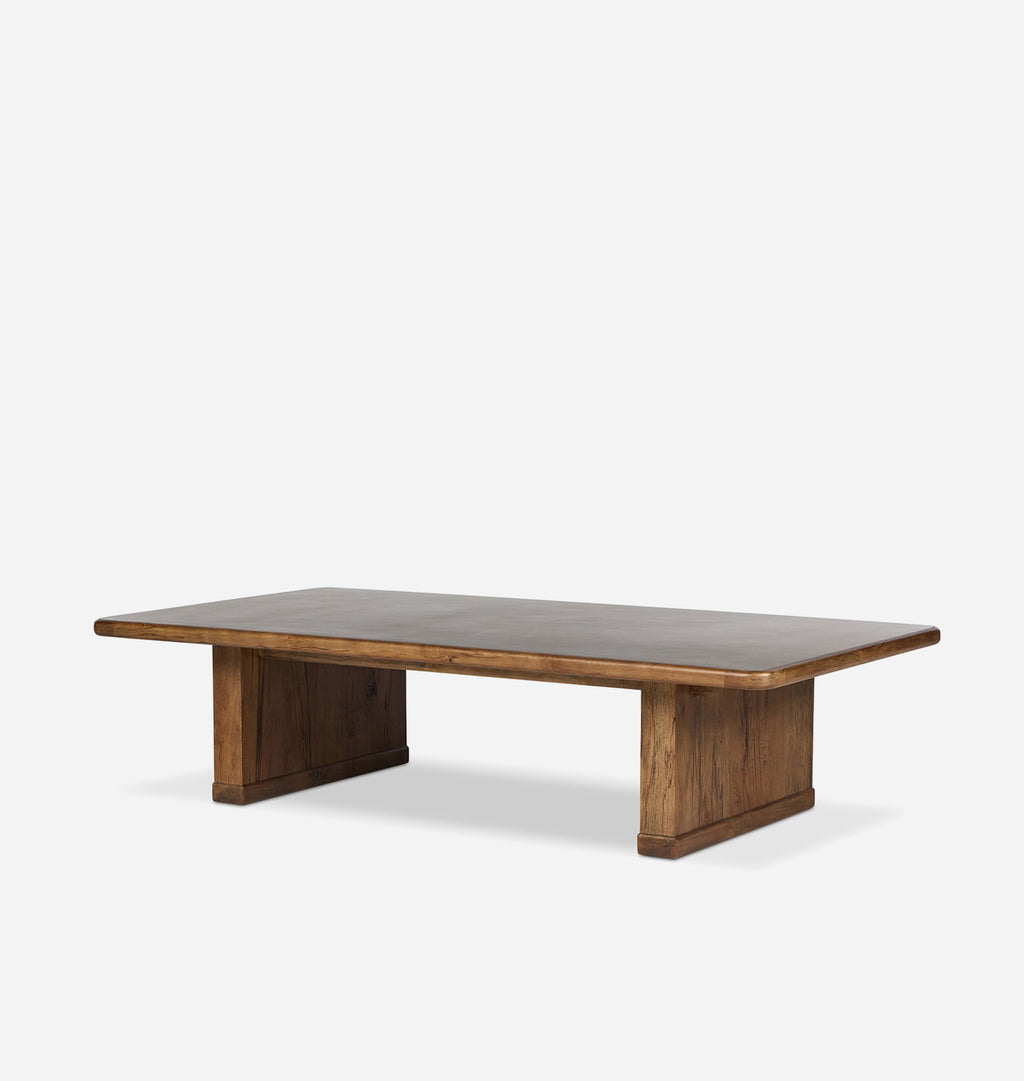 A rectangular wooden coffee table with a medium brown finish and rounded corners, shown on a light gray background.