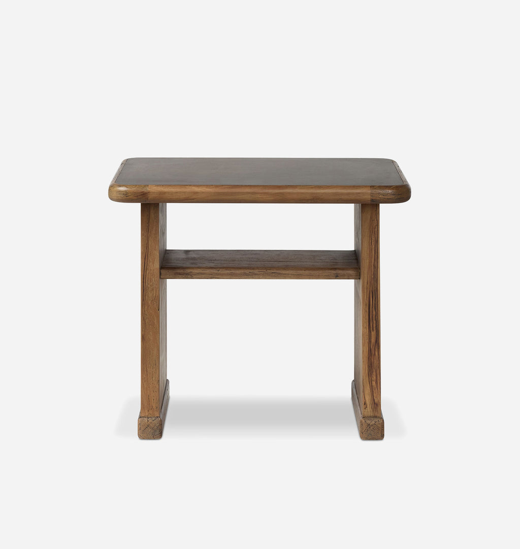 A rustic wooden side table with a thick rectangular top, four sturdy legs, and a lower shelf, shown against a plain light gray background.