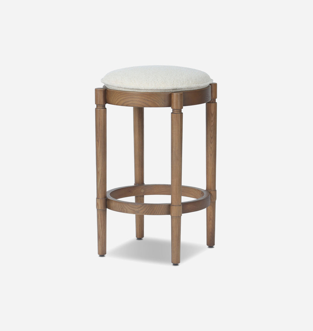 A wooden bar stool with a round off-white upholstered seat cushion and a natural oak wood frame, shown against a plain white background.