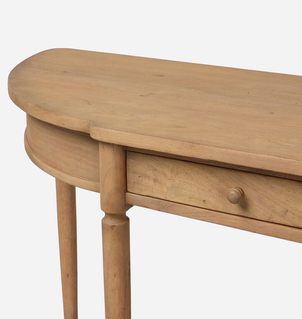 Close-up of a light natural wood console table showing a curved top, a single drawer with a round knob, and turned legs against a plain white background.