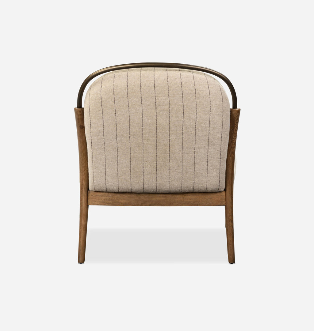 A modern accent chair featuring a curved wooden frame, a dark metal top rail, and a beige vertically ribbed fabric cushion, shown against a plain white background.