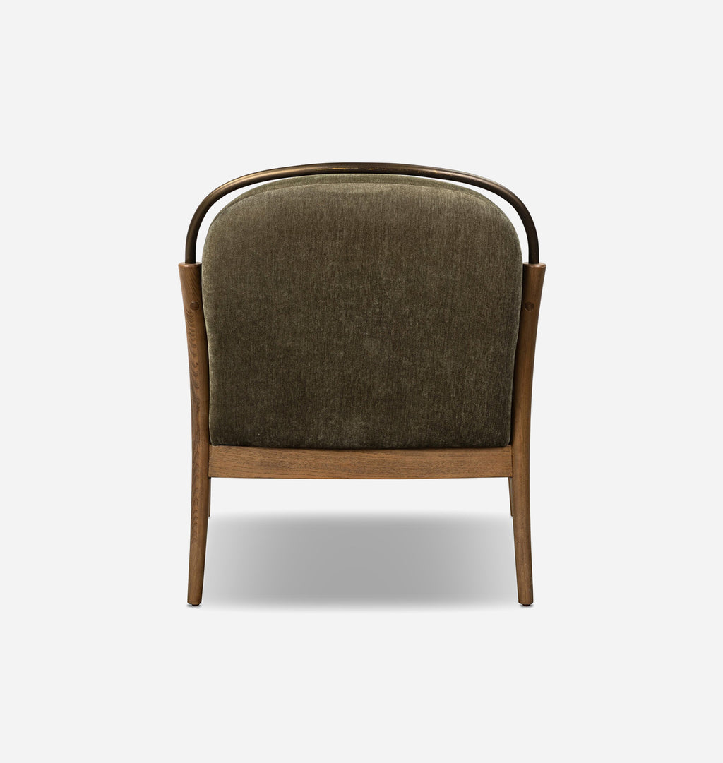 A modern lounge chair with a dark olive green textured fabric seat and back, supported by a light brown wooden frame with a curved dark metal top rail, shown from the rear on a light gray background.