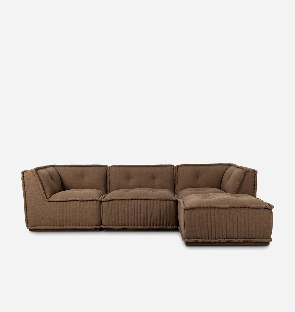 A modern modular sectional sofa in a warm brown fabric, featuring tufted back cushions and vertically pleated sides, shown against a plain light gray background.