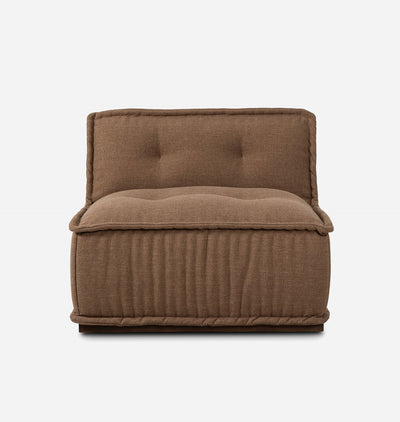 A brown upholstered floor cushion or small chair with a tufted backrest and ribbed sides, shown against a plain light gray background.