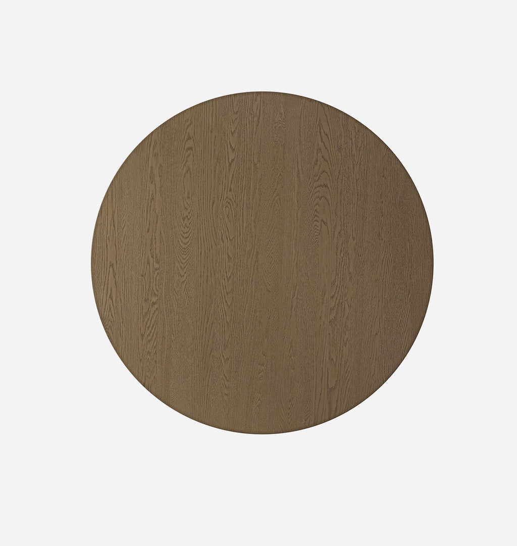 A circular wooden tabletop with a medium brown wood grain finish, shown from a top-down perspective on a solid white background.
