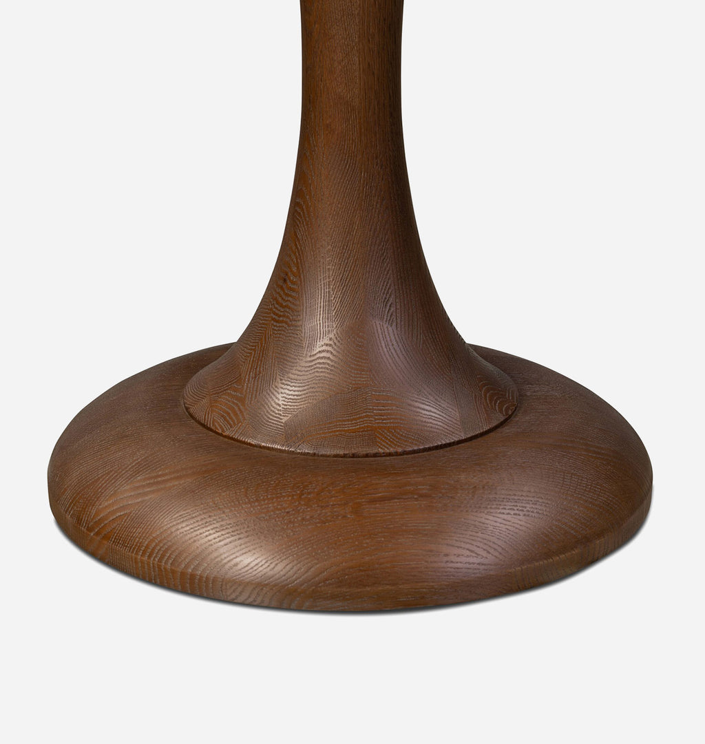 Close-up of a dark brown wooden pedestal base with a wide circular foot and a flared neck, shown against a light gray background.