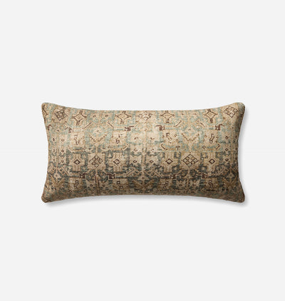 A rectangular lumbar throw pillow with a distressed, vintage-style geometric pattern in muted beige, teal, and brown tones, shown against a plain light gray background.