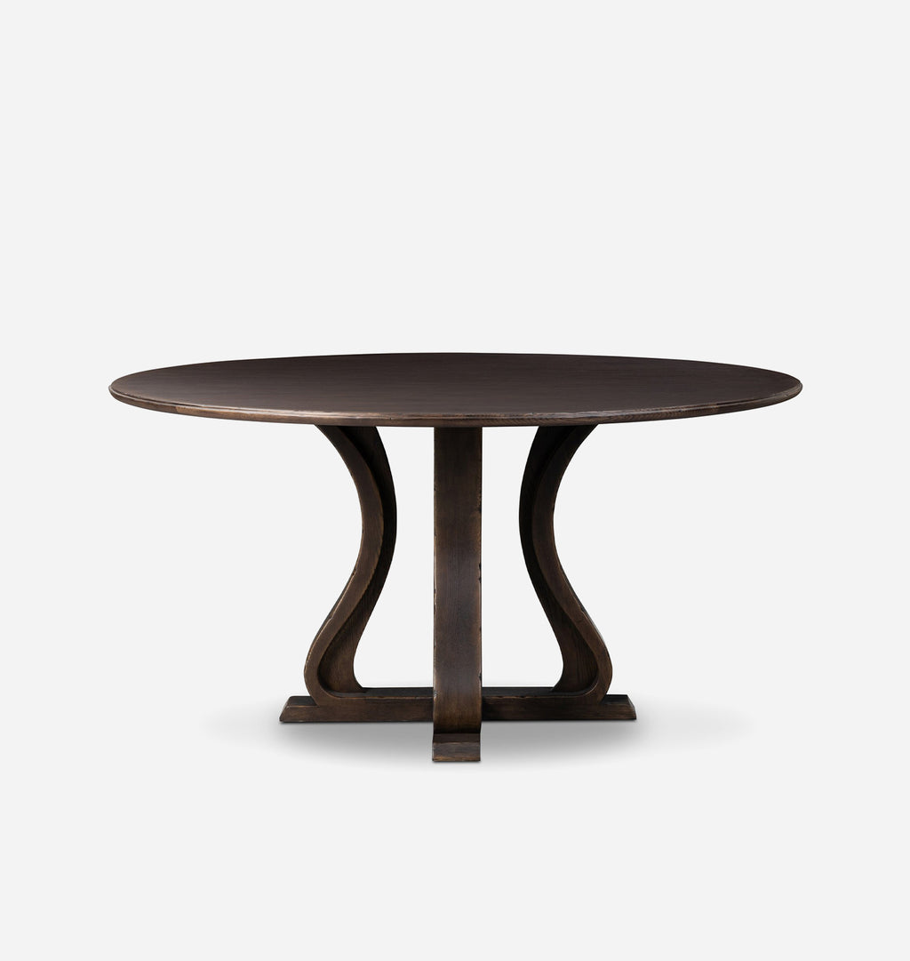 A round dark brown wooden dining table with a unique splayed pedestal base, shown against a plain light gray background.