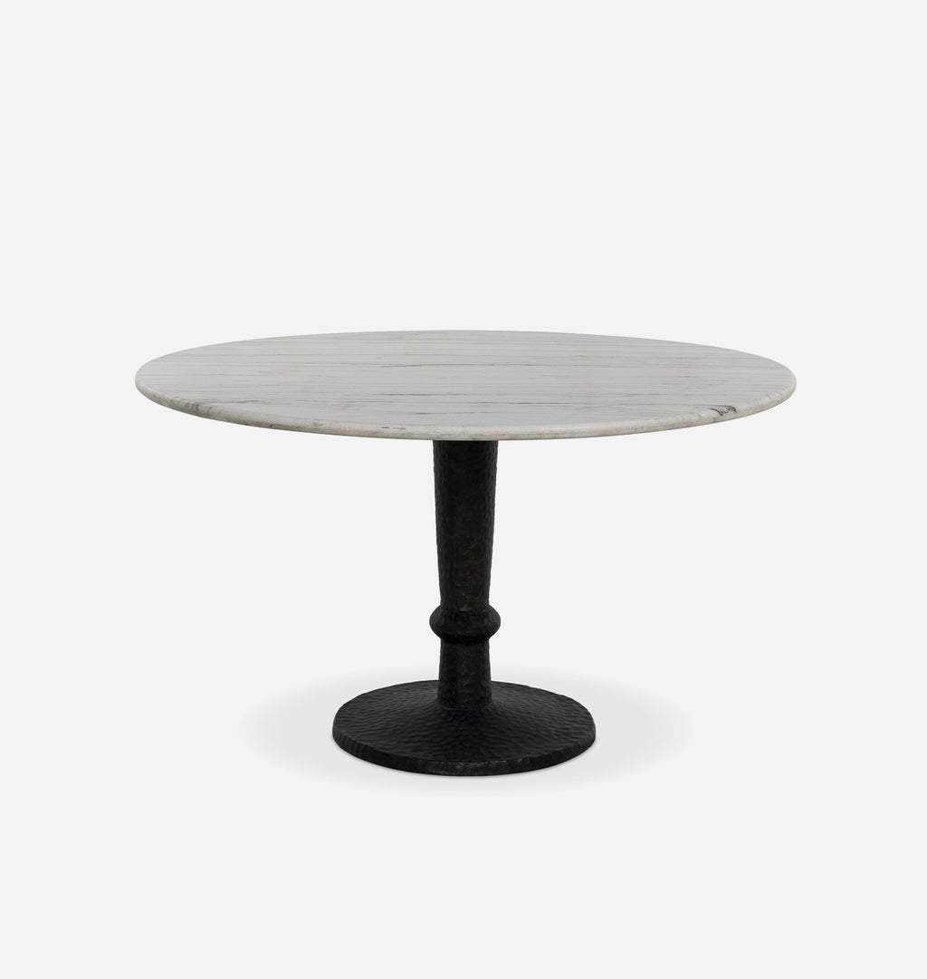A round dining table with a light gray marble top and a black cast iron pedestal base, shown against a plain white background.