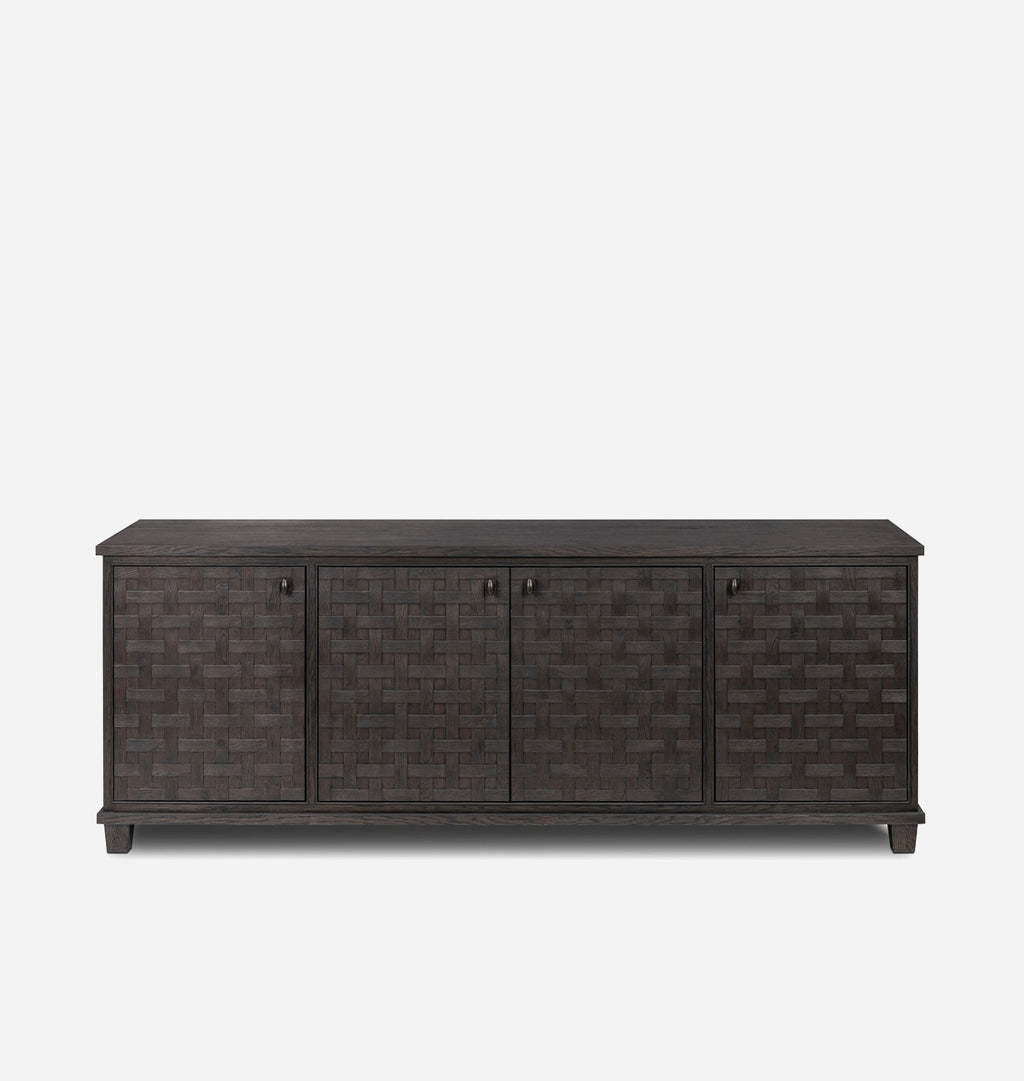 A dark brown wooden sideboard with three doors featuring a woven basket pattern, set against a plain light gray background.