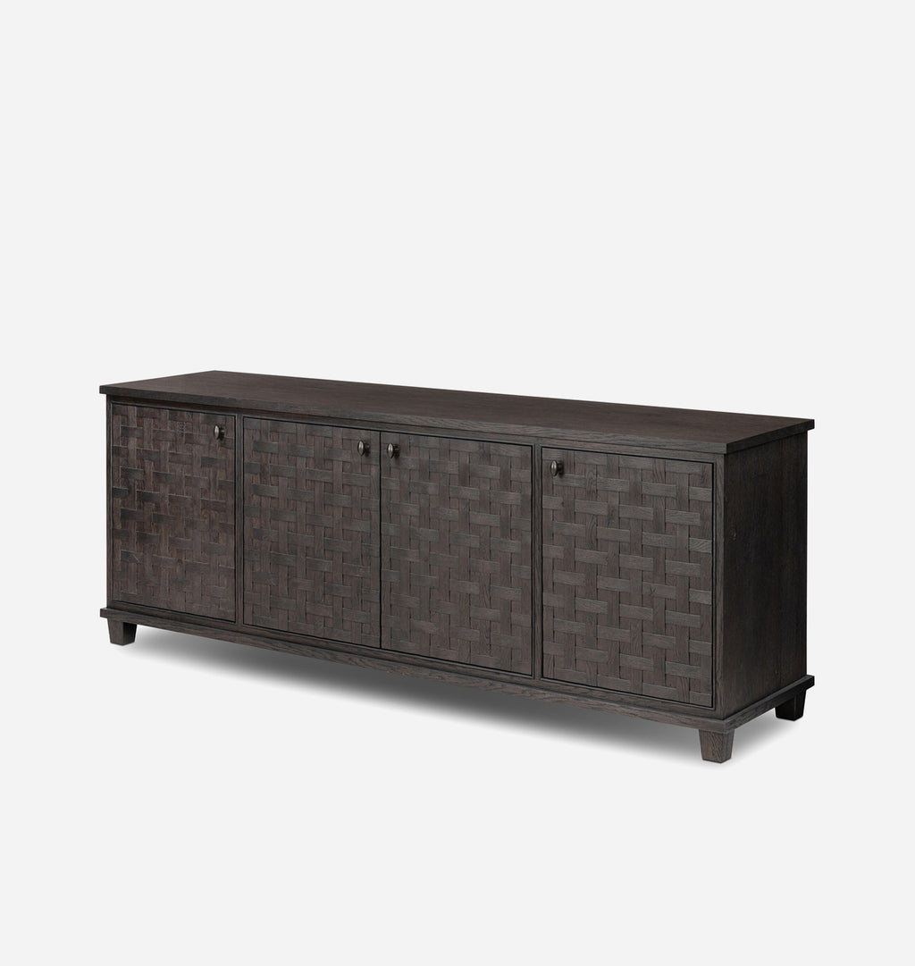 A dark brown wooden sideboard with three doors featuring a woven basket pattern, set against a plain light gray background.