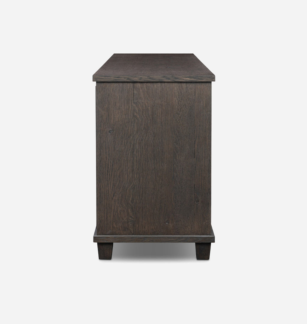 A dark brown wooden sideboard or cabinet with a rectangular top and four short legs, shown from the front on a light gray background.