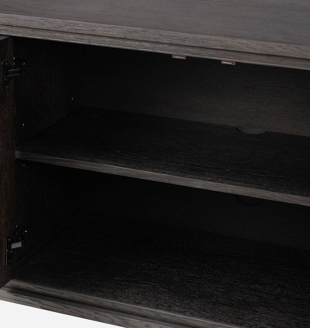 Close-up of the open interior of a dark wood cabinet or shelf unit with two visible shelves and dark hinges.