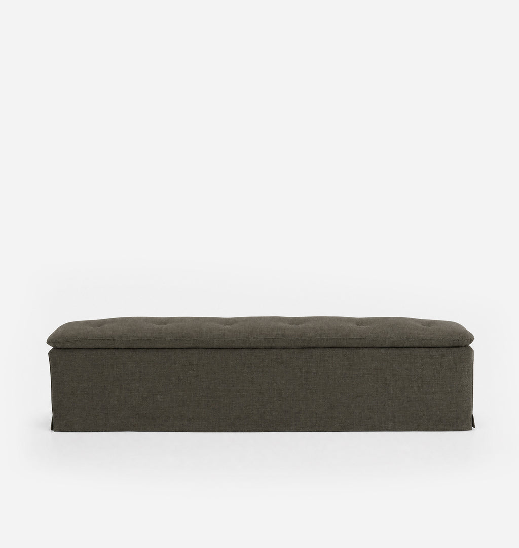 A rectangular upholstered bench with a tufted top cushion, shown from the front against a plain white background.