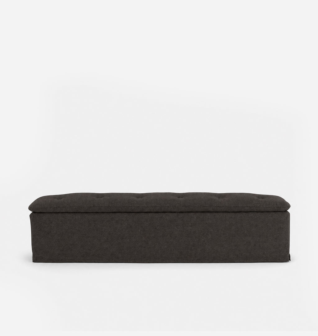 A dark brown upholstered bench with a tufted top, shown from a front-facing perspective against a plain white background.