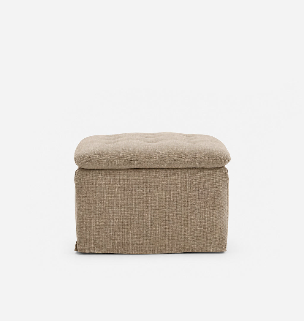 An upholstered ottoman with a tufted top, shown from the front against a plain white background.
